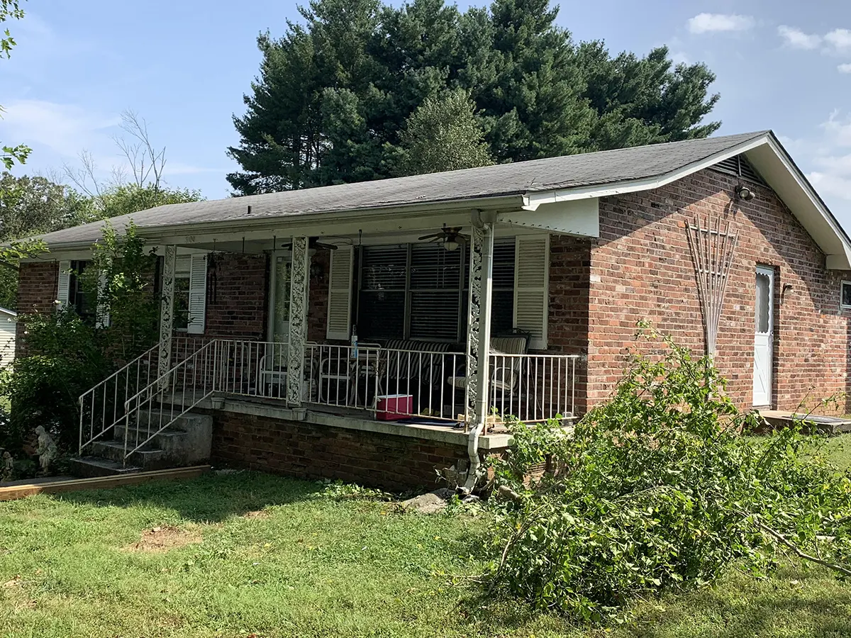 Small suburban house with old front porck