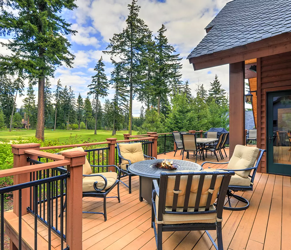 Large composite deck building project in Tennessee with sitting area and fire pit