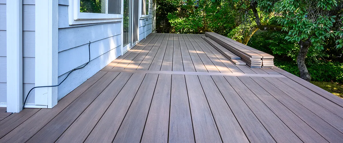 A composite deck on the side of a home