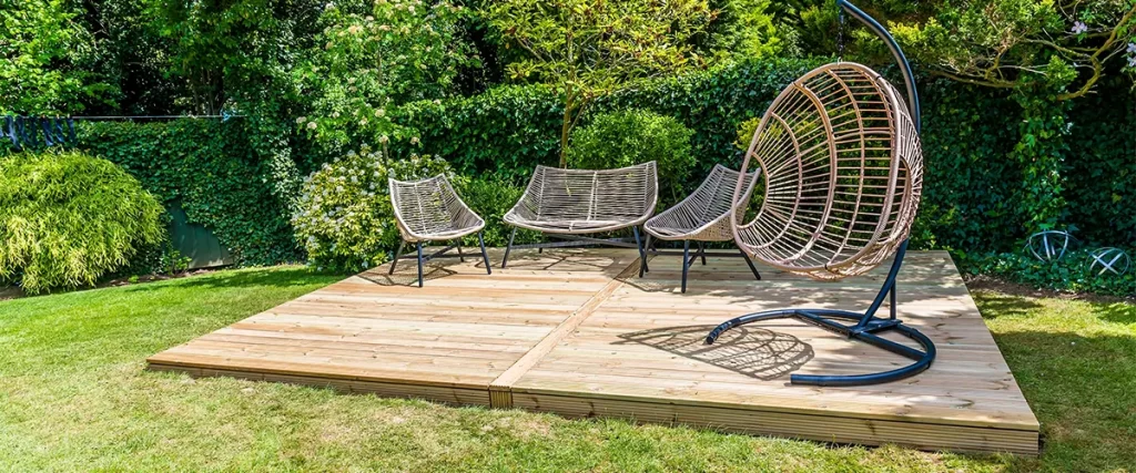 A couple of chairs on a free standing deck