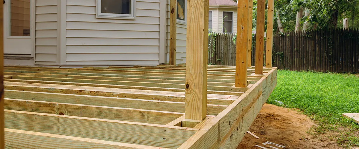 A pressure treated lumber frame for deck