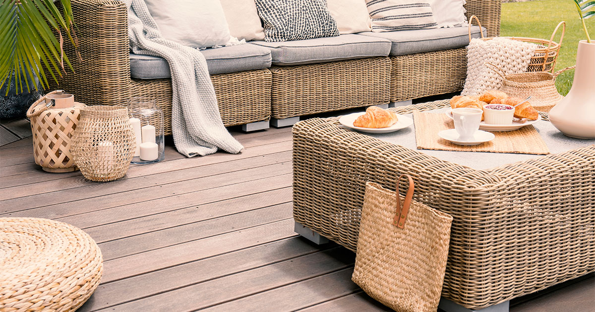 Best decking material options with a bench and a square table of a composite deck