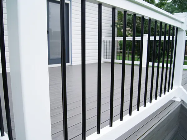 Metal railing with white wood balustrade