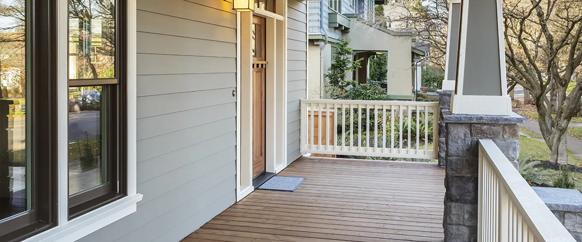 A front porch decking with what looks like cedar wood