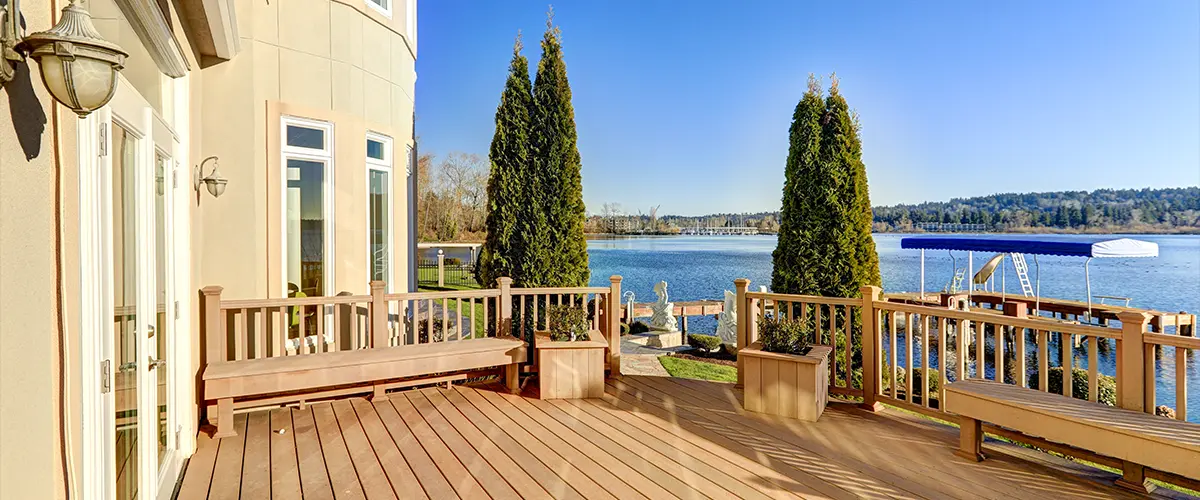 A composite deck and a beautiful lake behind it