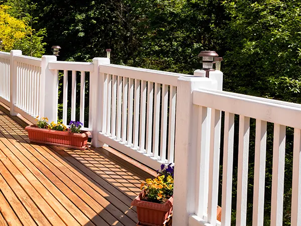 White composite railing on cedar deck
