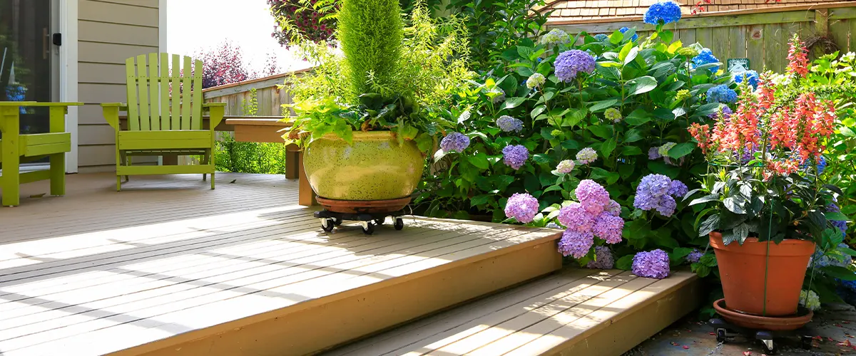 small deck with chairs and flowers