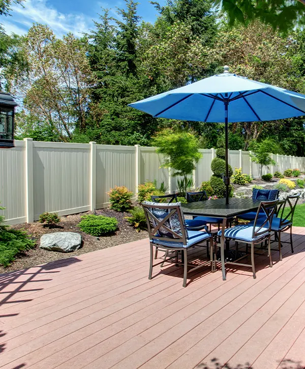 small wooden deck with table and chairs