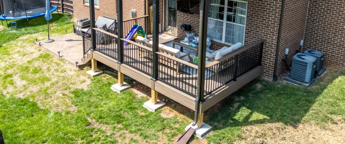 a modern residential composite deck with deck posts built by riverview decks, a deck builder based in knoxville tn