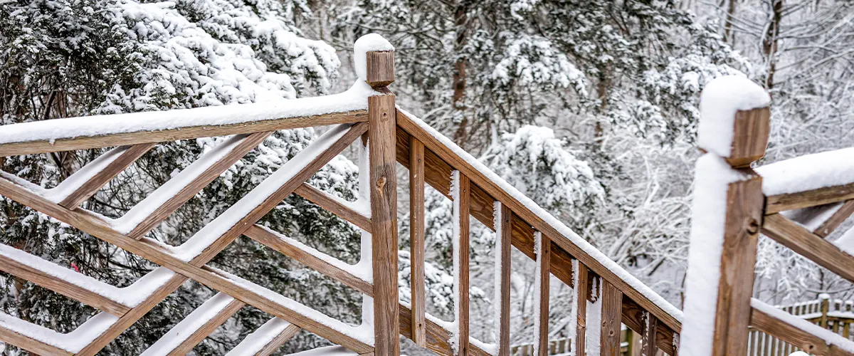 deck rails covered in snow