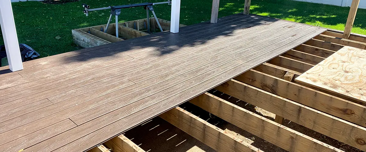 Composite decking on a pressure treated frame