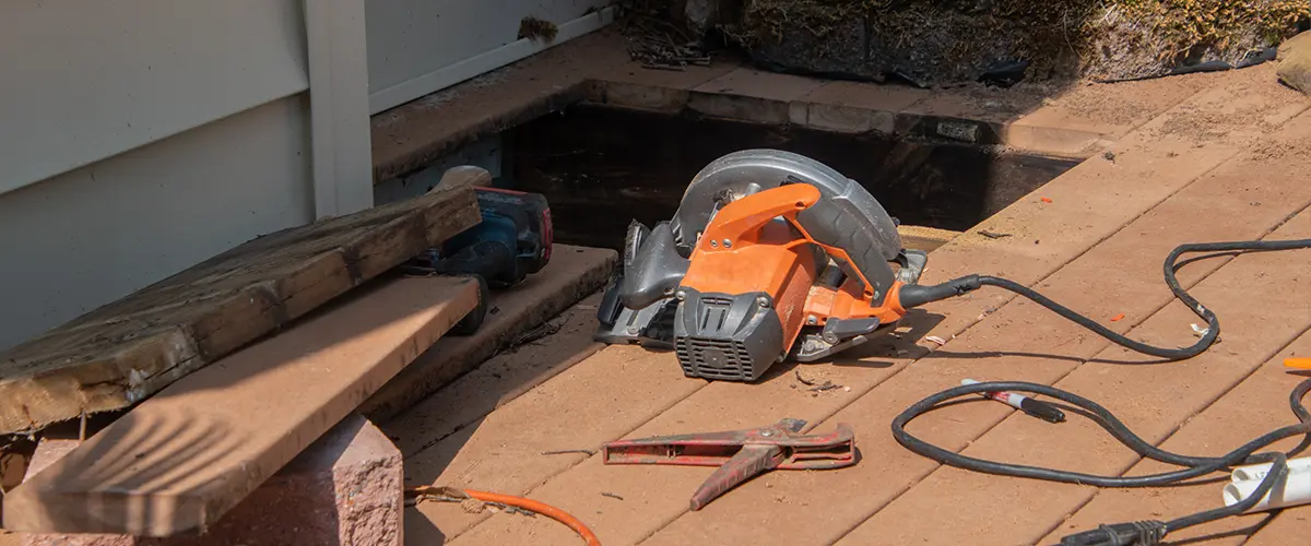 Materials and tools for installing a drainage system beneath a deck