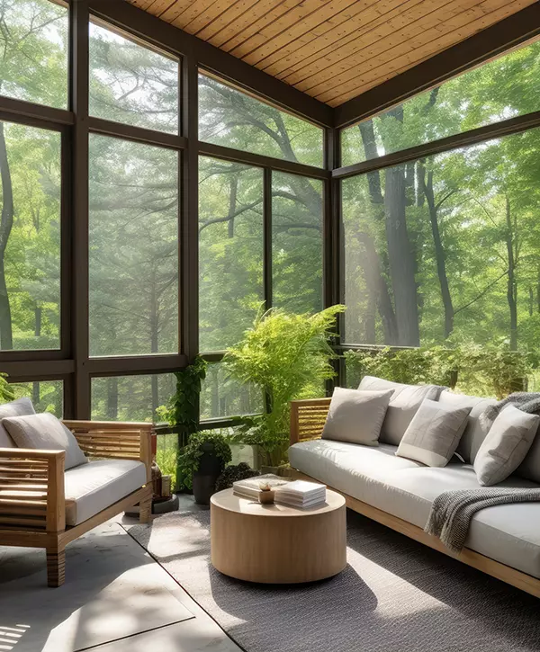 Contemporary screened porch with outdoor seating, forest scenery in summer deck addition