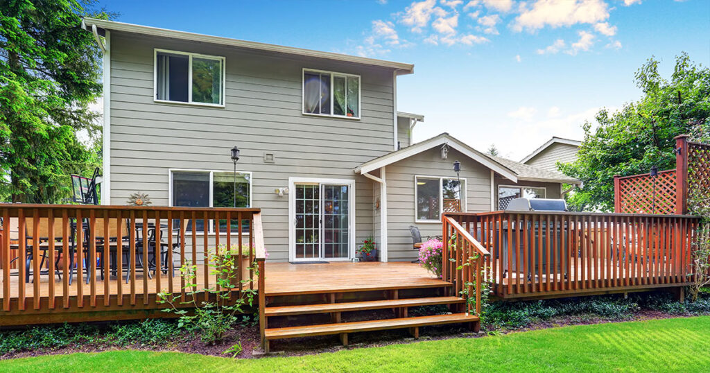 Back yard house exterior with spacious wooden deck