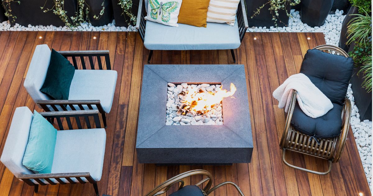 Modern outdoor deck with a fire pit and lounge seating