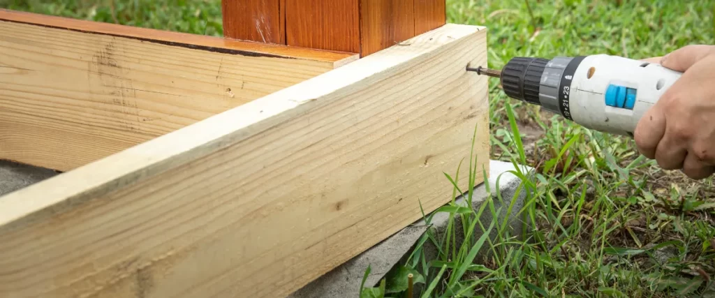 Close-up of a wooden deck frame with support beams