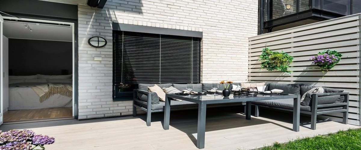 Grey chairs and wooden floor on the house deck