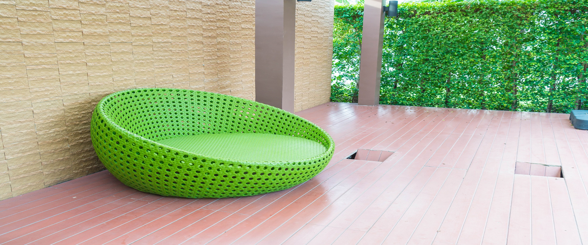 House deck with a green circle chair