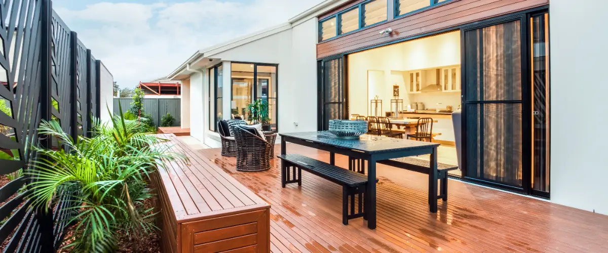 a modern outdoor living space featuring a wooden deck