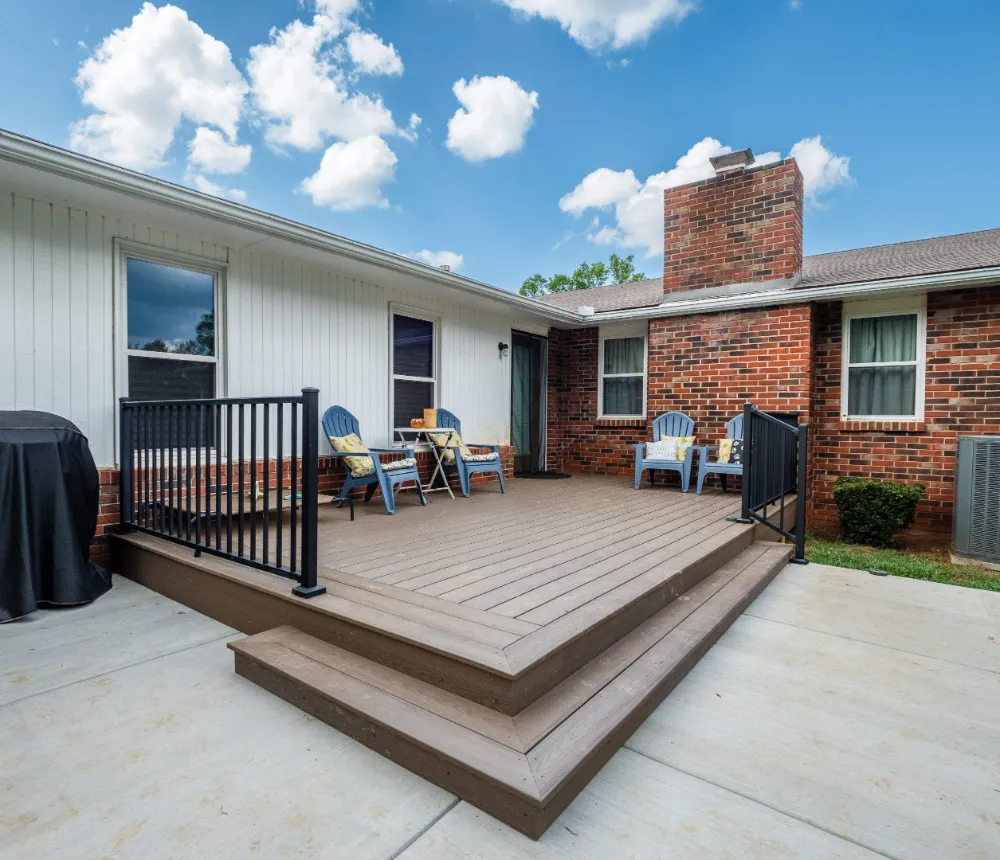multi-level composite deck in a backyard by riverview decks case study
