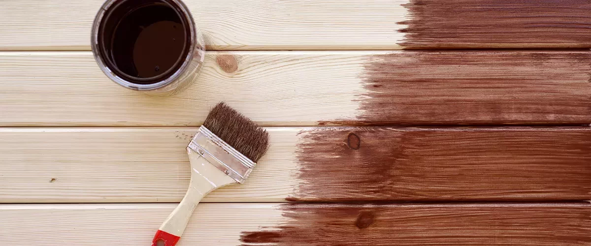 Painting a wooden shelf using paintbrush