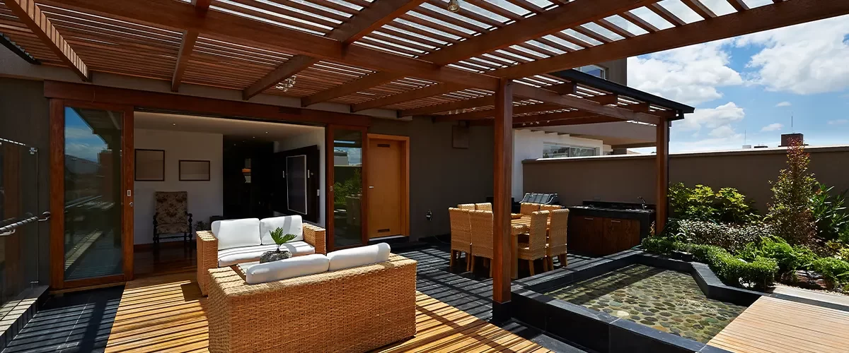 wooden deck under a wooden pergola